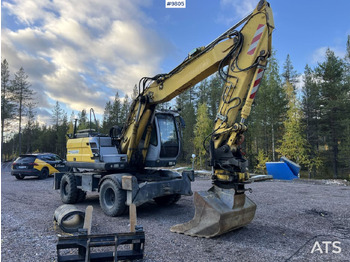 Grävmaskin på däck NEW HOLLAND