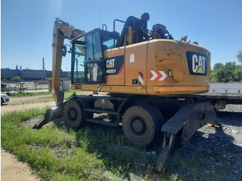 Grävmaskin på däck CATERPILLAR MH3024