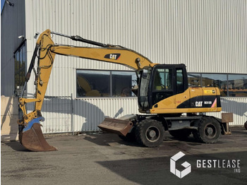 Grävmaskin på däck CATERPILLAR M313D