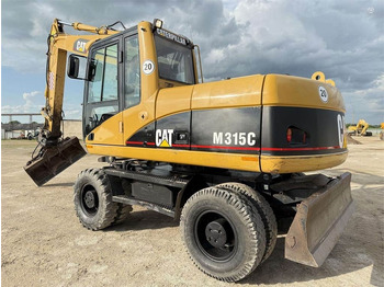 Grävmaskin på däck CATERPILLAR M315C