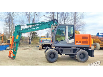 Grävmaskin på däck HITACHI ZX140W-3