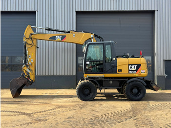 Grävmaskin på däck CATERPILLAR M313D