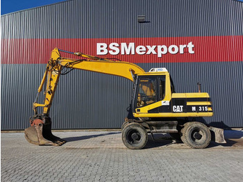 Grävmaskin på däck CATERPILLAR M315