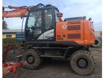 Grävmaskin på däck HITACHI ZX140W-5