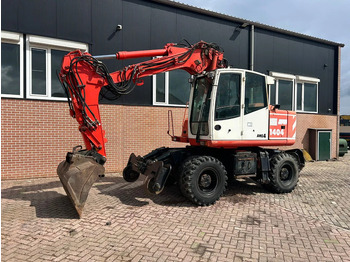 Grävmaskin på däck ATLAS