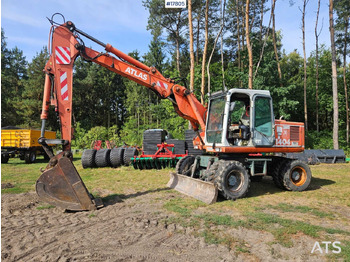 Grävmaskin på däck ATLAS