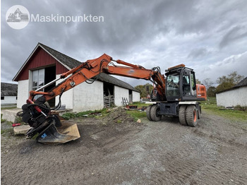 Grävmaskin på däck HITACHI ZX140W-3
