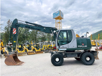 Grävmaskin på däck NEW HOLLAND