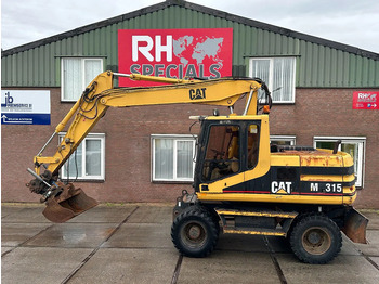 Grävmaskin på däck CATERPILLAR M315
