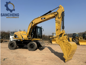 Grävmaskin på däck CATERPILLAR M320