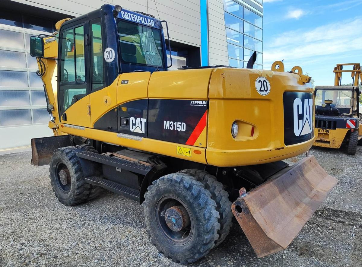 Caterpillar M315D - Grävmaskin på däck: bild 1 Caterpillar M315D - Grävmaskin på däck: bild 1