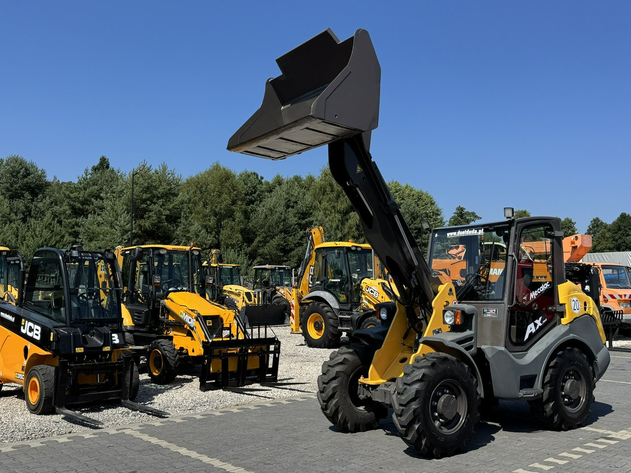 Mecalac AX 700 Szybko-Złącze Łyżka Super Stan - Hjullastare: bild 1 Mecalac AX 700 Szybko-Złącze Łyżka Super Stan - Hjullastare: bild 1