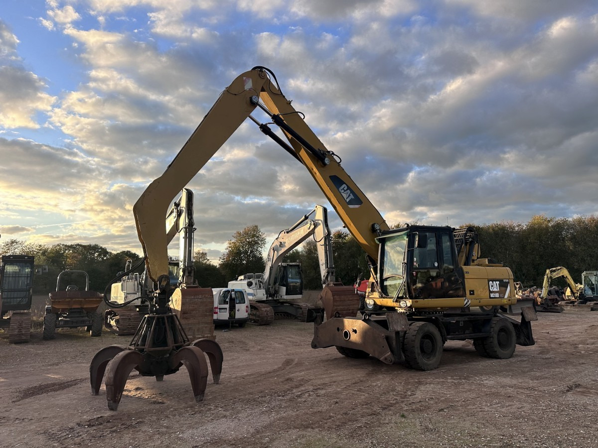 CATERPILLAR M 318 MH mit Greifer Kein 3022 3026 320 322 - Grävmaskin på däck: bild 1 CATERPILLAR M 318 MH mit Greifer Kein 3022 3026 320 322 - Grävmaskin på däck: bild 1