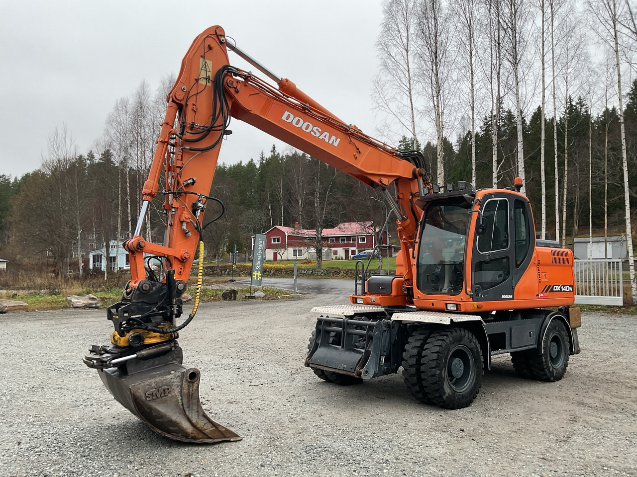 Doosan DX140W - Grävmaskin: bild 1 Doosan DX140W - Grävmaskin: bild 1