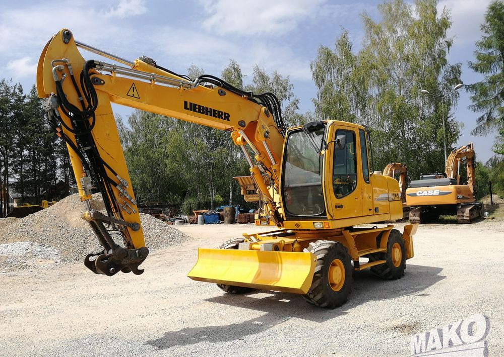 Liebherr A 314 Litronic - Grävmaskin på däck: bild 1 Liebherr A 314 Litronic - Grävmaskin på däck: bild 1