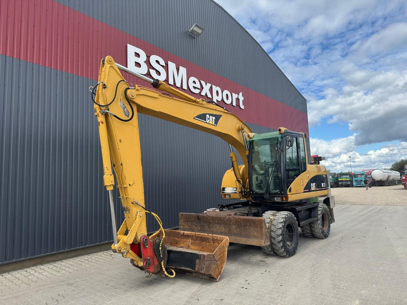 Caterpillar M 315 C - Grävmaskin på däck: bild 1 Caterpillar M 315 C - Grävmaskin på däck: bild 1