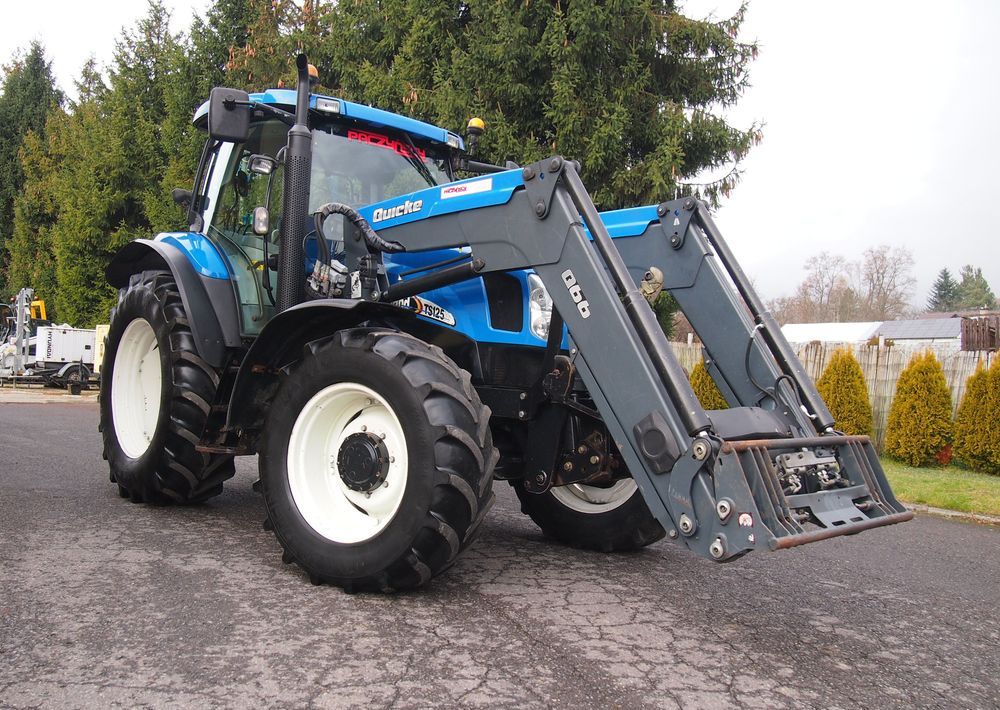 Ciągnik New Holland NH TS125A 6 cylindrów 2004 Ciągnik rolniczy New Holland TS125A - Traktor: bild 2 Ciągnik New Holland NH TS125A 6 cylindrów 2004 Ciągnik rolniczy New Holland TS125A - Traktor: bild 2