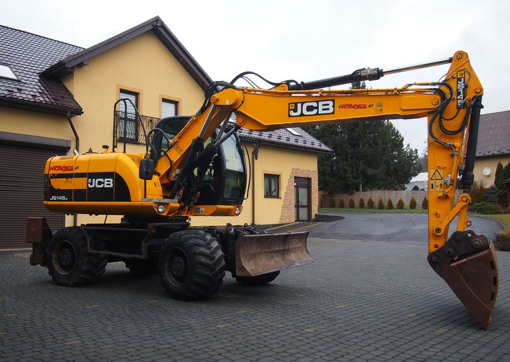 Koparka kołowa JCB JS145W 2011 Koparka JCB - Grävmaskin på däck: bild 1 Koparka kołowa JCB JS145W 2011 Koparka JCB - Grävmaskin på däck: bild 1