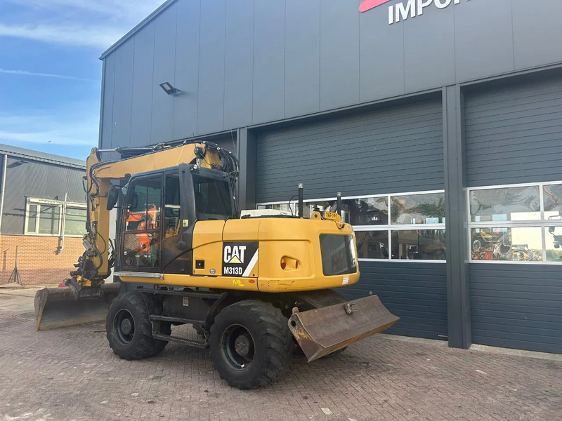 Caterpillar M313D - Grävmaskin på däck: bild 2 Caterpillar M313D - Grävmaskin på däck: bild 2