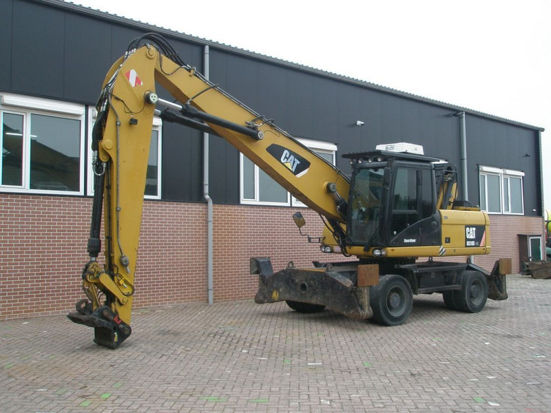 Caterpillar M318D - Grävmaskin på däck: bild 1 Caterpillar M318D - Grävmaskin på däck: bild 1
