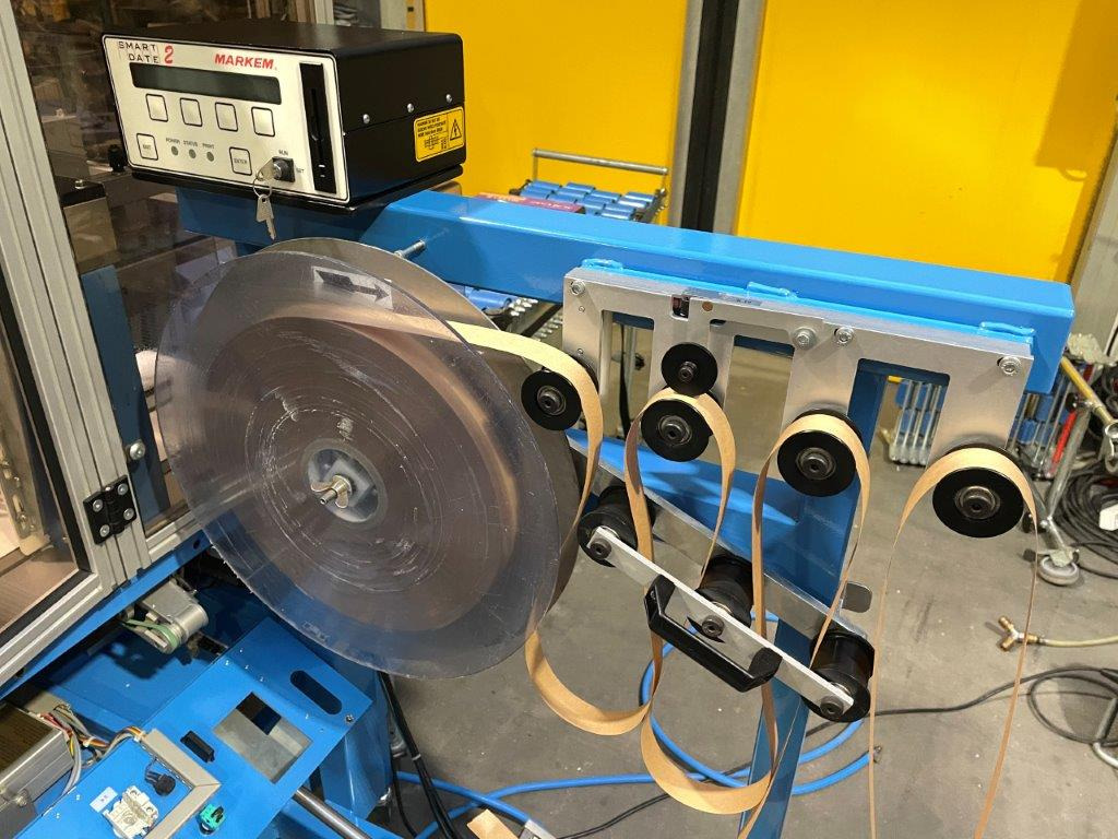 Förpackningsmaskin ATS Tanner UltraSonic US 2000-AB transit banding machine with pneumatic product hold-down and infeed roller table: bild 8