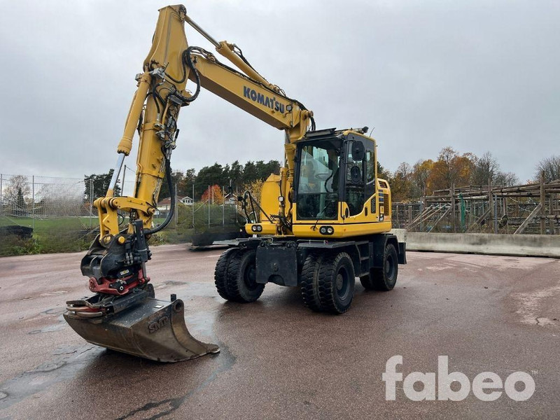 Komatsu PW 148 -10 - Grävmaskin på däck: bild 1 Komatsu PW 148 -10 - Grävmaskin på däck: bild 1