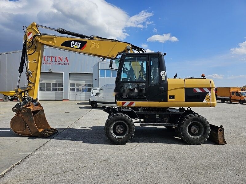 Caterpillar M315D - Grävmaskin på däck: bild 1 Caterpillar M315D - Grävmaskin på däck: bild 1