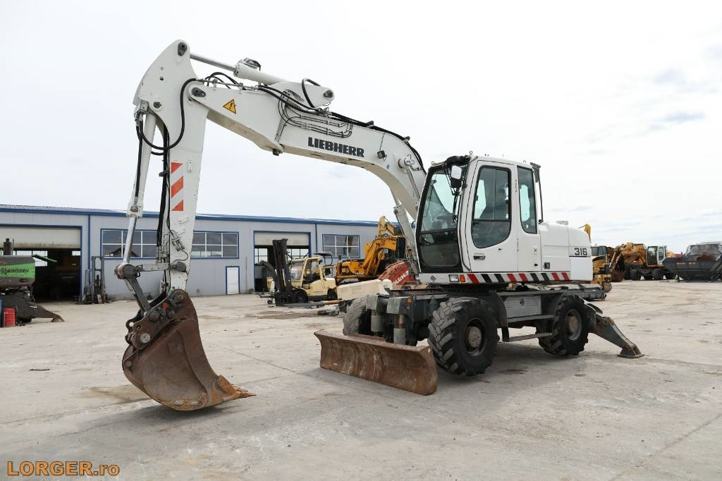 Liebherr A 316 Litronic  - Grävmaskin på däck: bild 5 Liebherr A 316 Litronic  - Grävmaskin på däck: bild 5