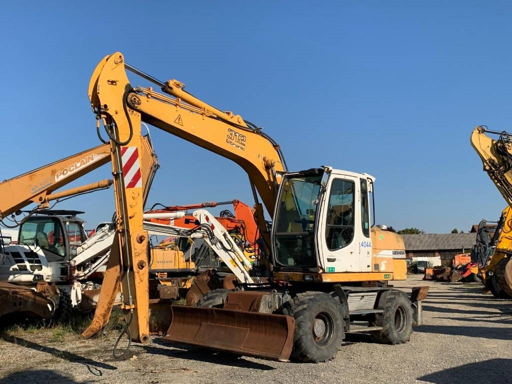 Liebherr A 312  - Grävmaskin på däck: bild 1 Liebherr A 312  - Grävmaskin på däck: bild 1