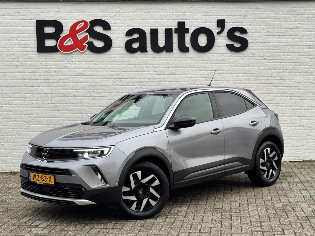 Opel Mokka-1.2 Turbo Elegance Cruise control Climate control Stoel- stuurverwarming Apple / Android Parkeersensoren plus camera - SUV: bild 1 Opel Mokka-1.2 Turbo Elegance Cruise control Climate control Stoel- stuurverwarming Apple / Android Parkeersensoren plus camera - SUV: bild 1