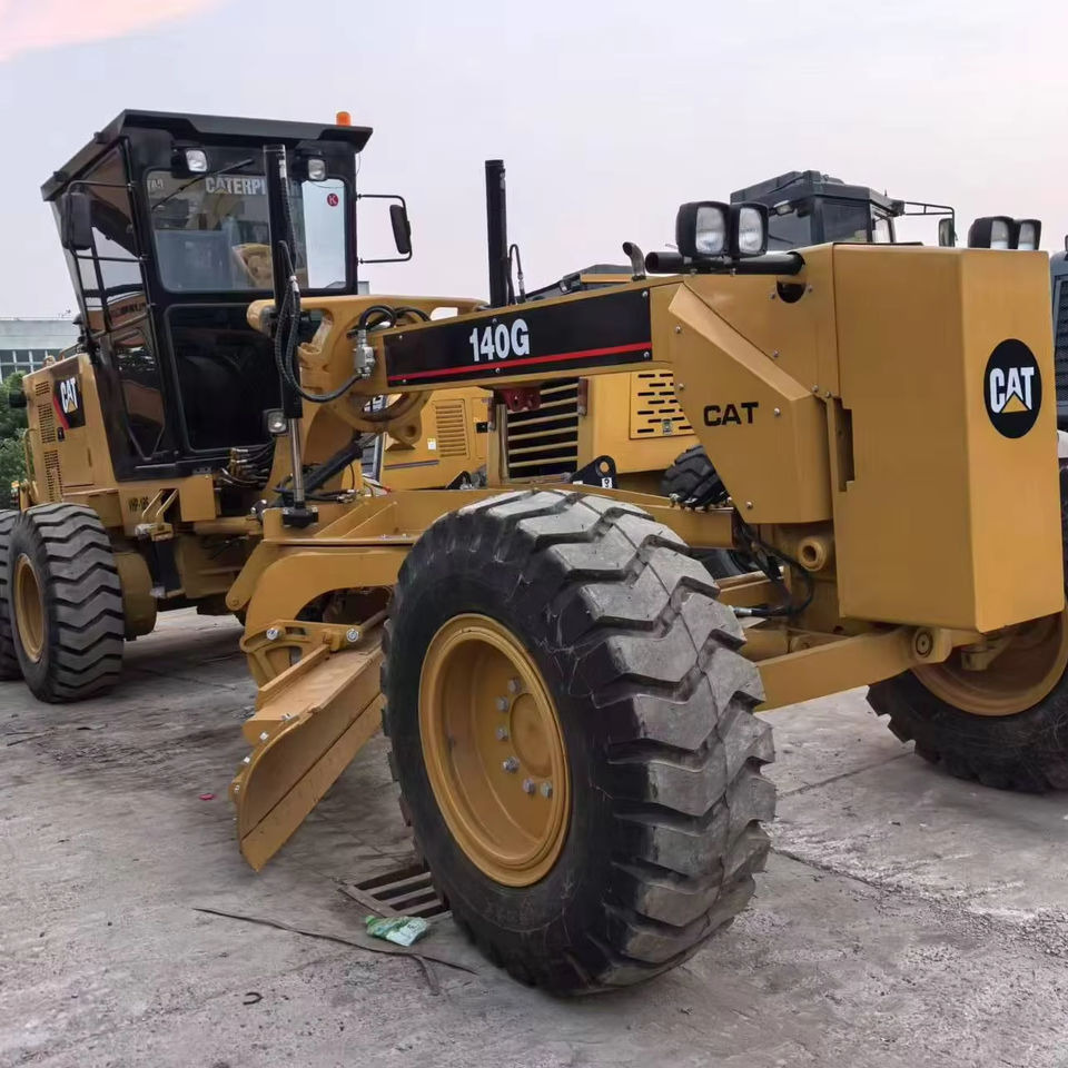 Second Hand Used Construction Machinery Japanese CAT 140G Grader Caterpillar Brand for Sale With Good Condition and Price - Väghyvel: bild 1 Second Hand Used Construction Machinery Japanese CAT 140G Grader Caterpillar Brand for Sale With Good Condition and Price - Väghyvel: bild 1