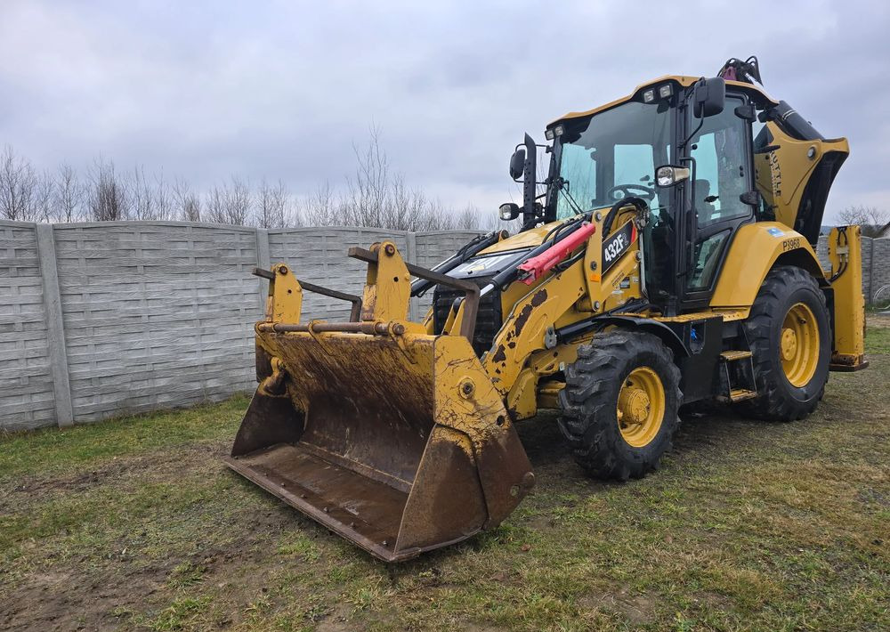 Caterpillar - Grävlastare: bild 1 Caterpillar - Grävlastare: bild 1