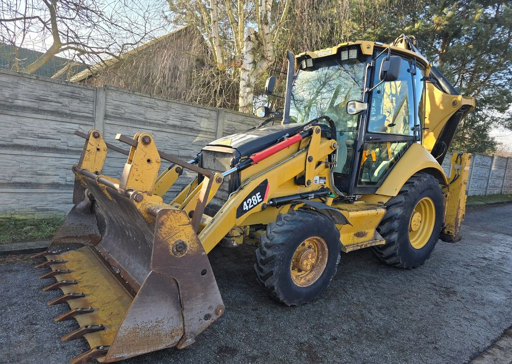 Caterpillar - Grävlastare: bild 1 Caterpillar - Grävlastare: bild 1