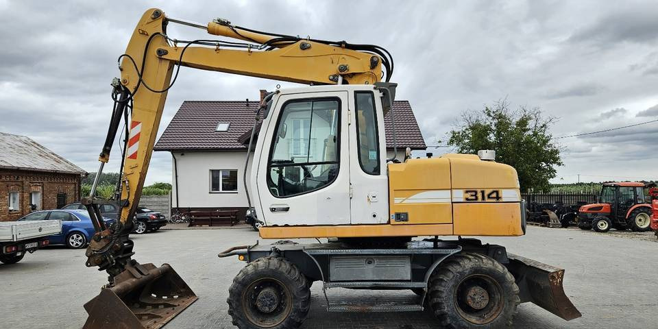 Koparka kołowa Liebherr A314 Litronic 9350 h 4 łyżki kołówka - Grävmaskin på däck: bild 1 Koparka kołowa Liebherr A314 Litronic 9350 h 4 łyżki kołówka - Grävmaskin på däck: bild 1