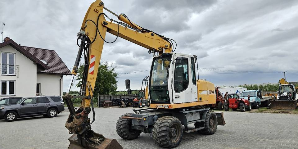 Koparka kołowa Liebherr A314 Litronic 9350 h 4 łyżki kołówka - Grävmaskin på däck: bild 2 Koparka kołowa Liebherr A314 Litronic 9350 h 4 łyżki kołówka - Grävmaskin på däck: bild 2